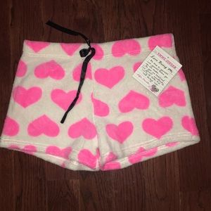 A pair of white fleece pajama shorts